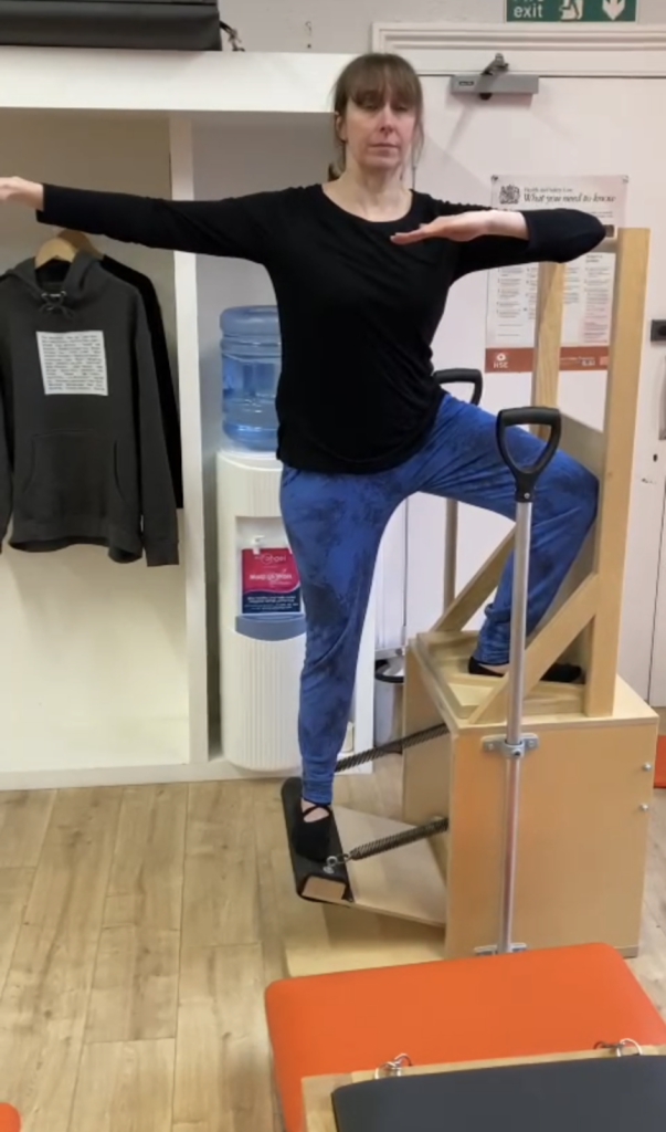 Person doing Pilates on a high chair